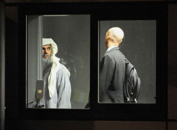 Radical cleric Abu Qatada prepares to board a plane which will take him to Jordan, after he was deported from the UK to face terrorism charges in his home country, on July 7 in London, England.
