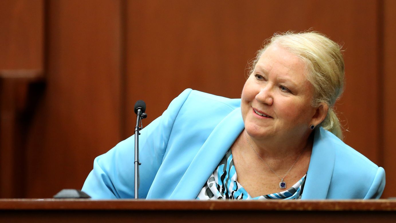 Leanne Benjamin, a friend of Zimmerman's, smiles while identifying him in court on July 8.
