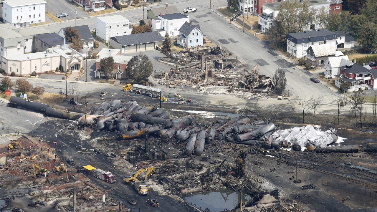 Burned tanker cars are scattered on the tracks in Lac-Megantic, Quebec, on Monday, July 8.