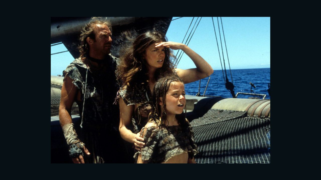 An image from "Waterworld" shows Kevin Costner as the Mariner, Jeanne Tripplehorn as Helen and Tina Majorino as Enola.