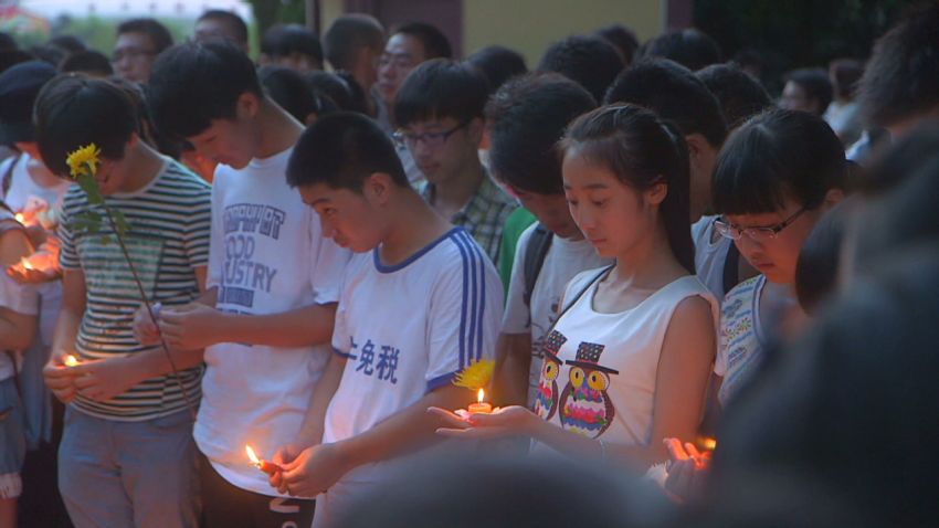 mckenzie pkg china asiana victim vigil_00002330.jpg