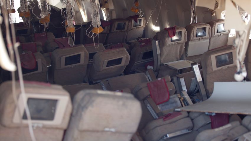 In this handout photo provided by the National Transportation Safety Board, oxygen masks hang from the ceiling in the cabin interior of Asiana Airlines flight 214 following yesterday's crash, on July 7, 2013 in San Francisco, California. The Boeing 777 passenger aircraft from Asiana Airlines coming from Seoul, South Korea crashed landed on the runway at San Francisco International Airport. Two people died and dozens were injured in the crash. (Photo by NTSB via Getty Images)