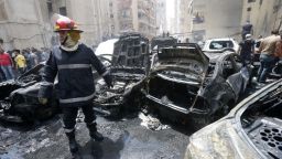 Burned vehicles at the site of an explosion in Beirut's southern suburb neighbourhood of Bir al-Abed on July 9, 2013.
