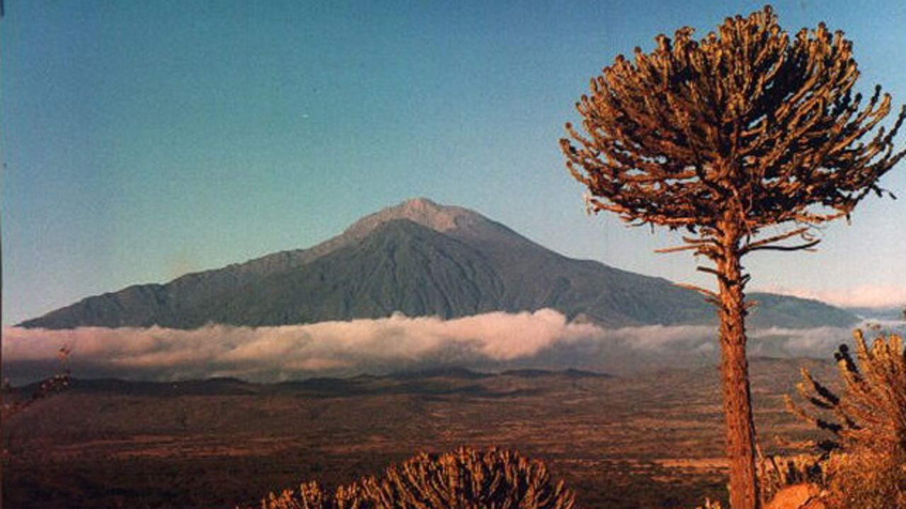 Mount Meru is a beautiful extinct volcano that's often used by mountaineers for acclimatization before trekking Kilimanjaro. <em>Peak: 4,565 meters.</em>