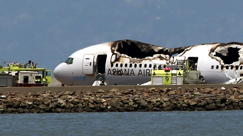 A Boeing 777 airplane lies burned on the runway after it crashed landed at San Francisco International Airport July 6, 2013 in San Francisco, California.