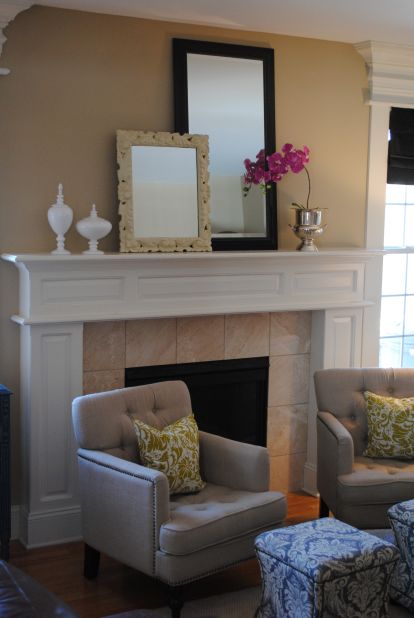 <a href="http://ireport.cnn.com/docs/DOC-1000852">Holly Modica</a> of Middletown, Connecticut, used mirrors on her mantel to add whimsy and interest and to highlight the room's height.