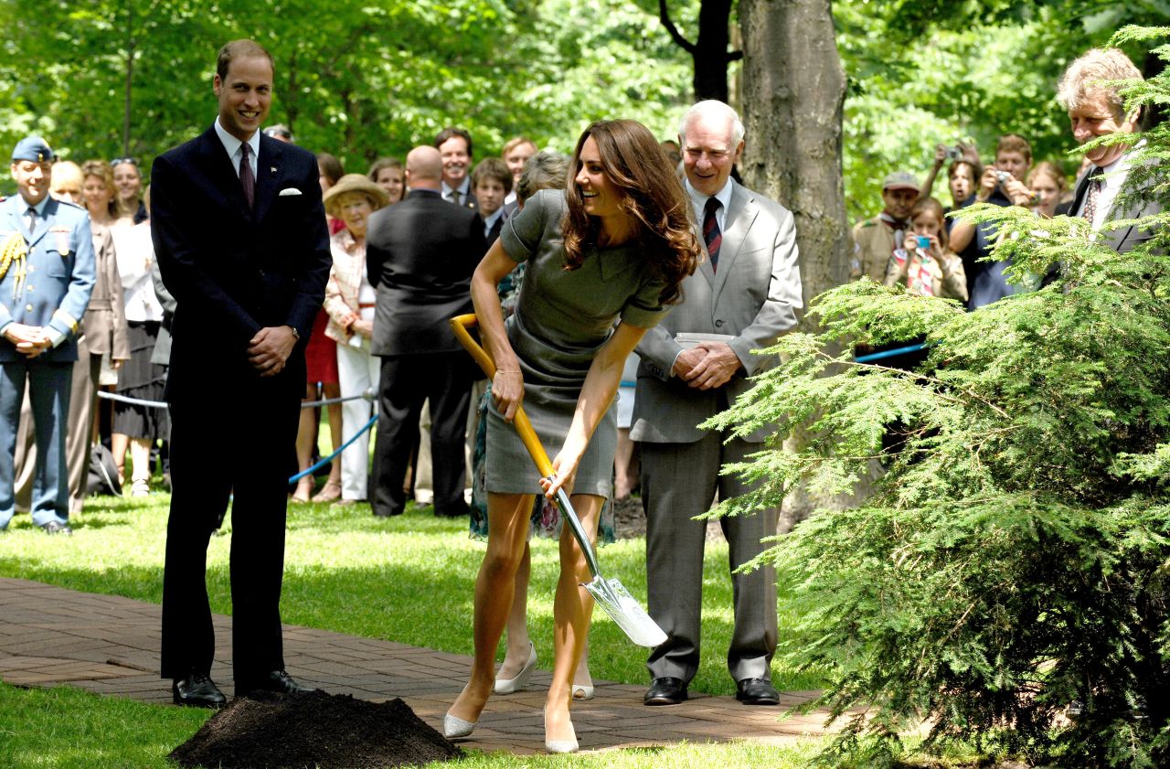 Catherine shovels soil during a tree-planting ceremony in Ottawa in July 2011.