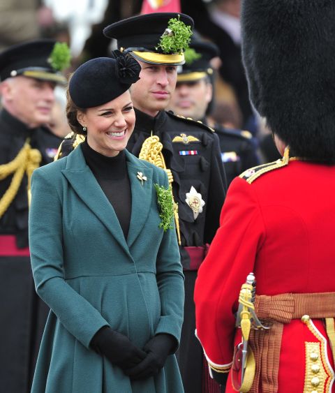 The couple attends a St. Patrick's Day parade as they visit Aldershot, England, in March 2013.