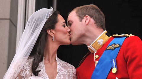 Prince William and Catherine share a wedding day kiss on the balcony at Buckingham Palace, London, in April 2011.