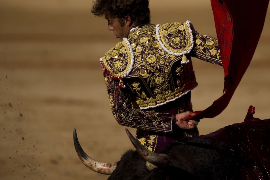 Spanish matador Manuel Escribano takes on a bull during the San Fermin festival on July 8. The bulls that run through Pamplona's streets end up in the central bull ring.