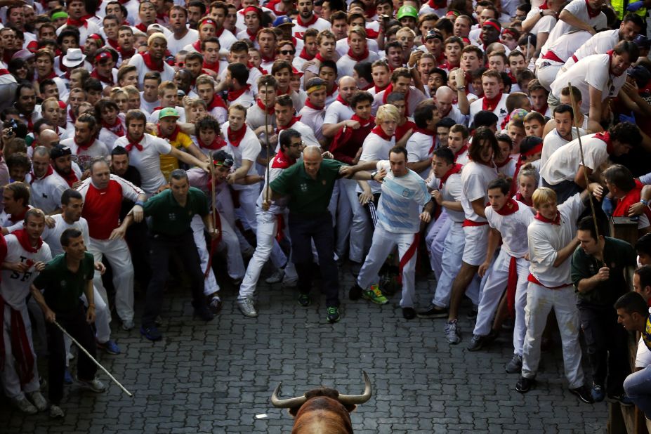 Participants back away from a bull on July 7.