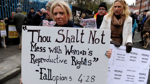 A protester displays a banner against Ireland's abortion laws in Dublin on November 24.