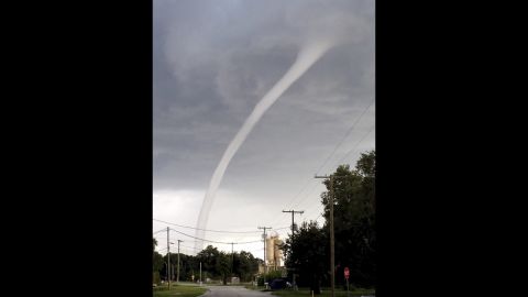 A waterspout comes ashore in Oldsmar, Florida, on Monday, July 8. Authorities say the waterspout caused damage to the shingles of a home and knocked down tree branches and a mailbox, but no injuries were reported. 