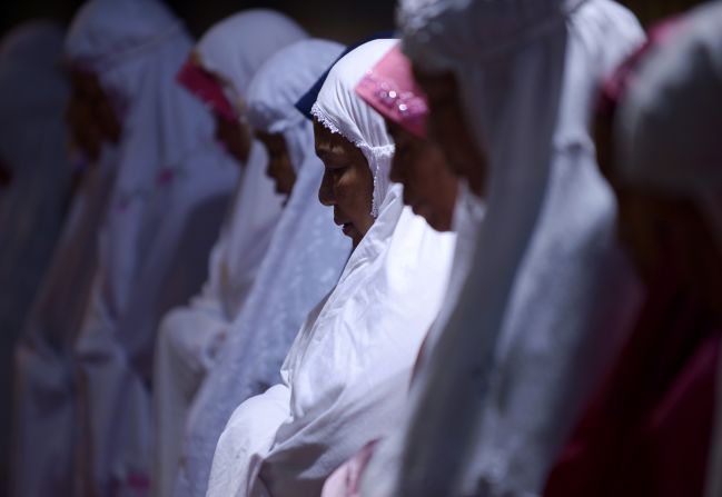 JULY 10 - JAKARTA, INDONESIA: Women hold prayers on the first night of the holy month of Ramadan at the Istiqlal mosque in Jakarta. Islam's holy month of Ramadan is marked by fasting, abstaining from foods, sex and smoking from dawn to dusk for soul cleansing and strengthening the spiritual bond between them and the Almighty.