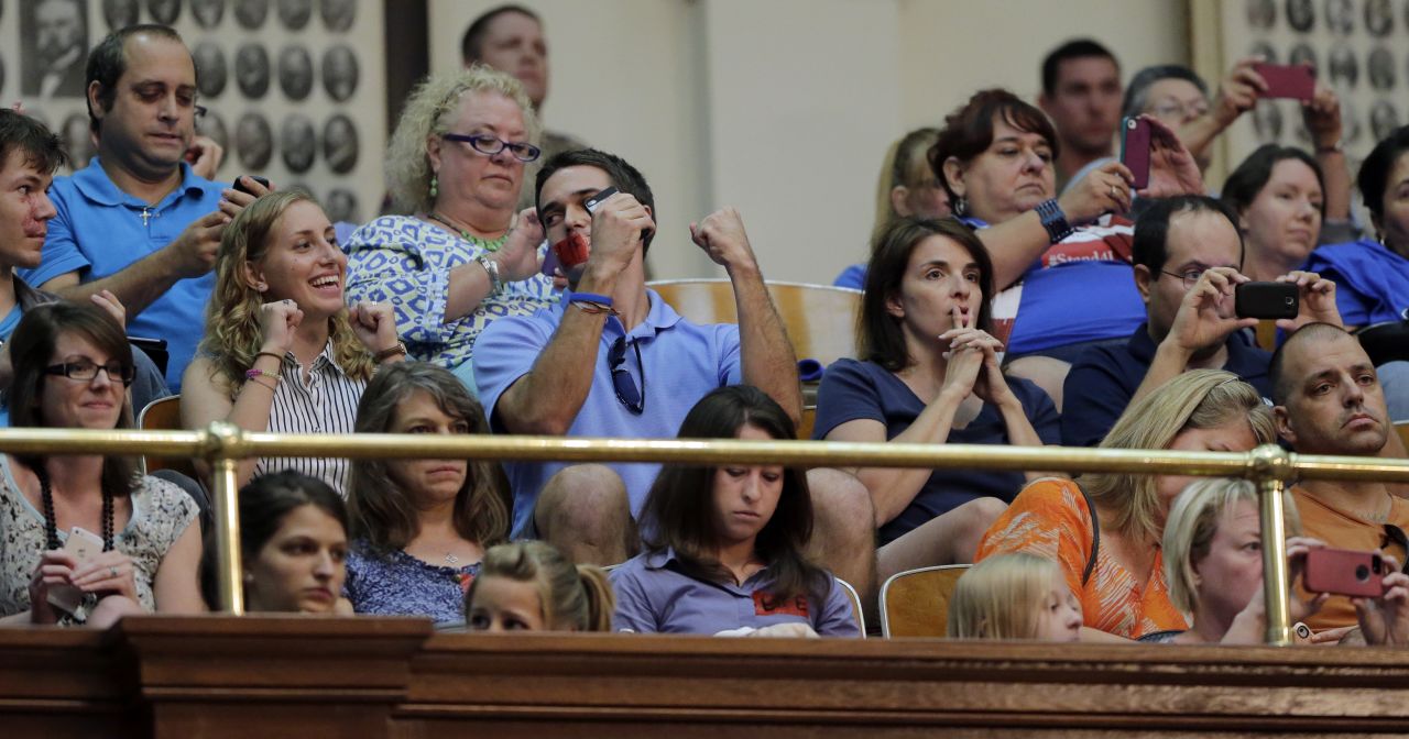 Supporters of the measure react in the gallery of the Texas House after it was provisionally approved during the second special session on July 9, 2013.