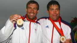 Andrew Simpson (R) receives his gold medals alongside best friend and crewmate Iain Percy at the Beijing Olympics in 2008.