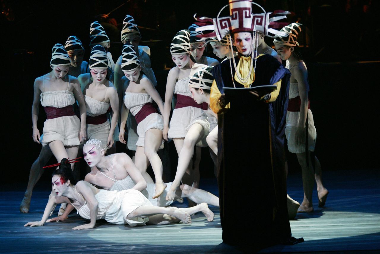 Jin Xing, lower left,  performs in June 2005 at the Palais des Congres in Paris during the rehearsal of the symphonic dance 'Carmina Burana'. 