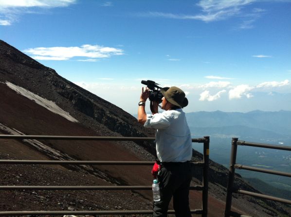 Our cameraman, Hide, gives some perspective on how steep the slopes of Mount Fuji are.