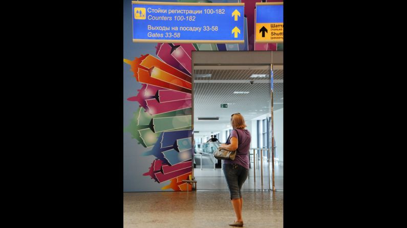 A woman stands at the entrance that links terminals D and E at Sheremetyevo.