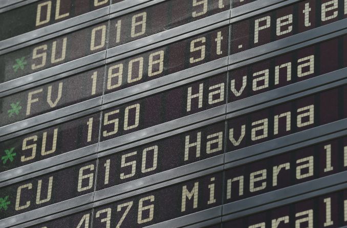 The departure board shows when a flight is leaving from Moscow to Havana, Cuba. 