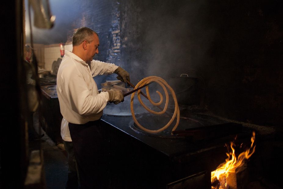 A man makes churros, often referred to as Spanish doughnuts, early July 11 in Pamplona. 