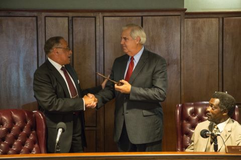 At his swearing-in ceremony in early July, Bill Luckett, right, takes the helm of the city from outgoing Mayor Henry Espy, who stepped down after serving for more than 20 years. Clarksdale's new mayor says he doesn't believe the speculation about why McMillian was killed.