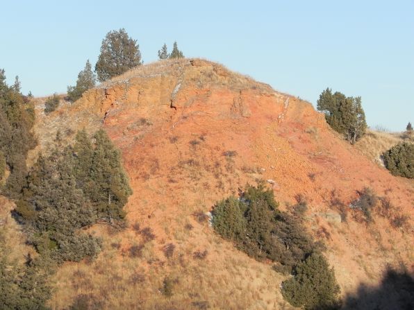 The bentonite clay of Scoria Point in the South Unit was baked red by underground coal beds ignited by lightning strikes.