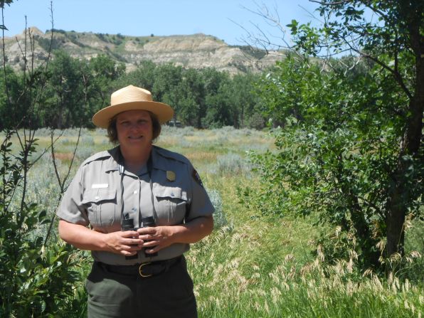 Valerie Naylor, who says she never leaves home without her binoculars, was inspired to become a park ranger by volunteering at Theodore Roosevelt. She has been superintendent of her "home park" since 2003.