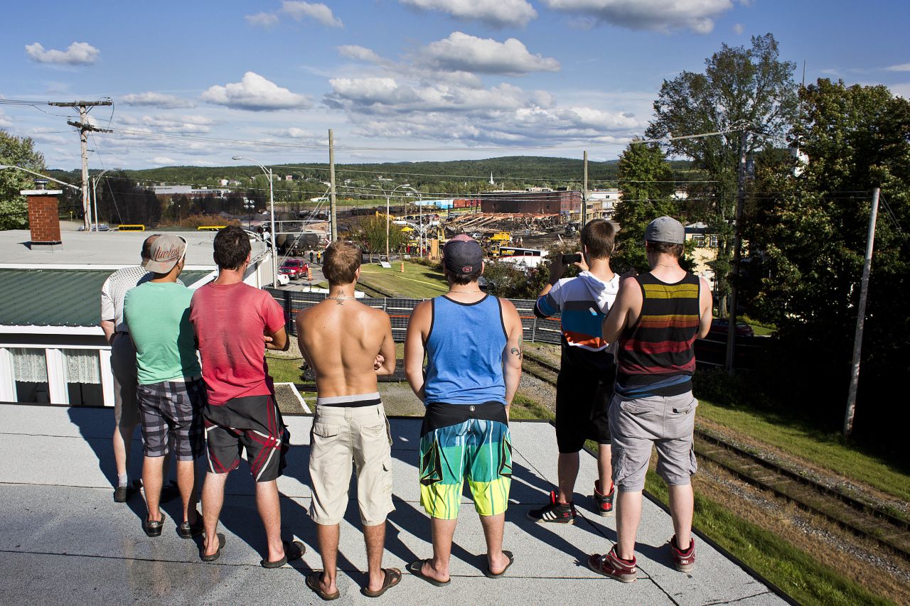 Shortly after authorities open some barricaded streets, a group of young men stop by to check out the wreckage in downtown Lac-Megantic. It is a sad and stunning sight.