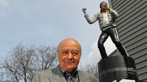 Mohamed Al Fayed, who sold Fulham on Friday, stands near a statue of Michael Jackson outside Fulham's stadium in 2011. 
