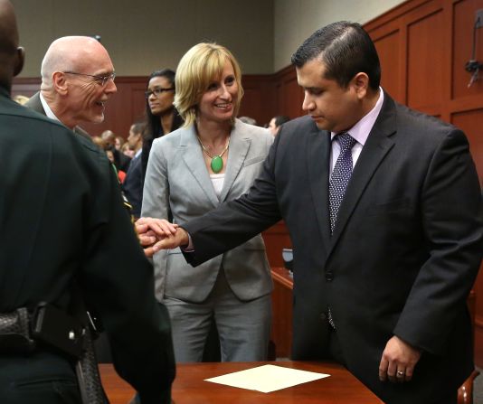 George Zimmerman is congratulated by members of his defense team, Don West and Lorna Truett, after the not guilty verdict is read on Saturday, July 13, in Sanford, Florida. A jury of six women found him  not guilty in the shooting death of Trayvon Martin. <a href="index.php?page=&url=http%3A%2F%2Fwww.cnn.com%2F2013%2F07%2F13%2Fjustice%2Fgallery%2Fzimmerman-trial-reaction%2Findex.html" target="_blank">View photos of the public reaction to the verdict.</a>