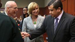 George Zimmerman is congratulated by members of his defense team, Don West and Lorna Truett, after the not guilty verdict is read on Saturday, July 13, in Sanford, Florida. A jury of six women found him  not guilty in the shooting death of Trayvon Martin. View photos of the public reaction to the verdict.