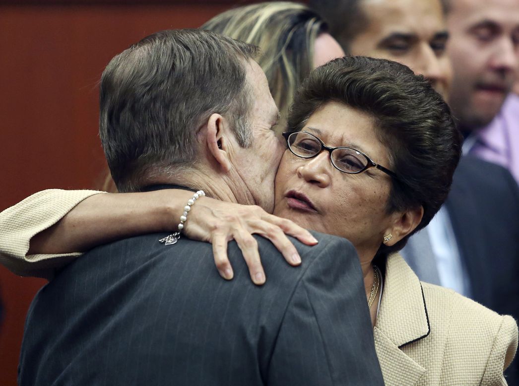 Robert Zimmerman Sr. and Gladys Zimmerman embrace after their son is found not guilty on July 13.
