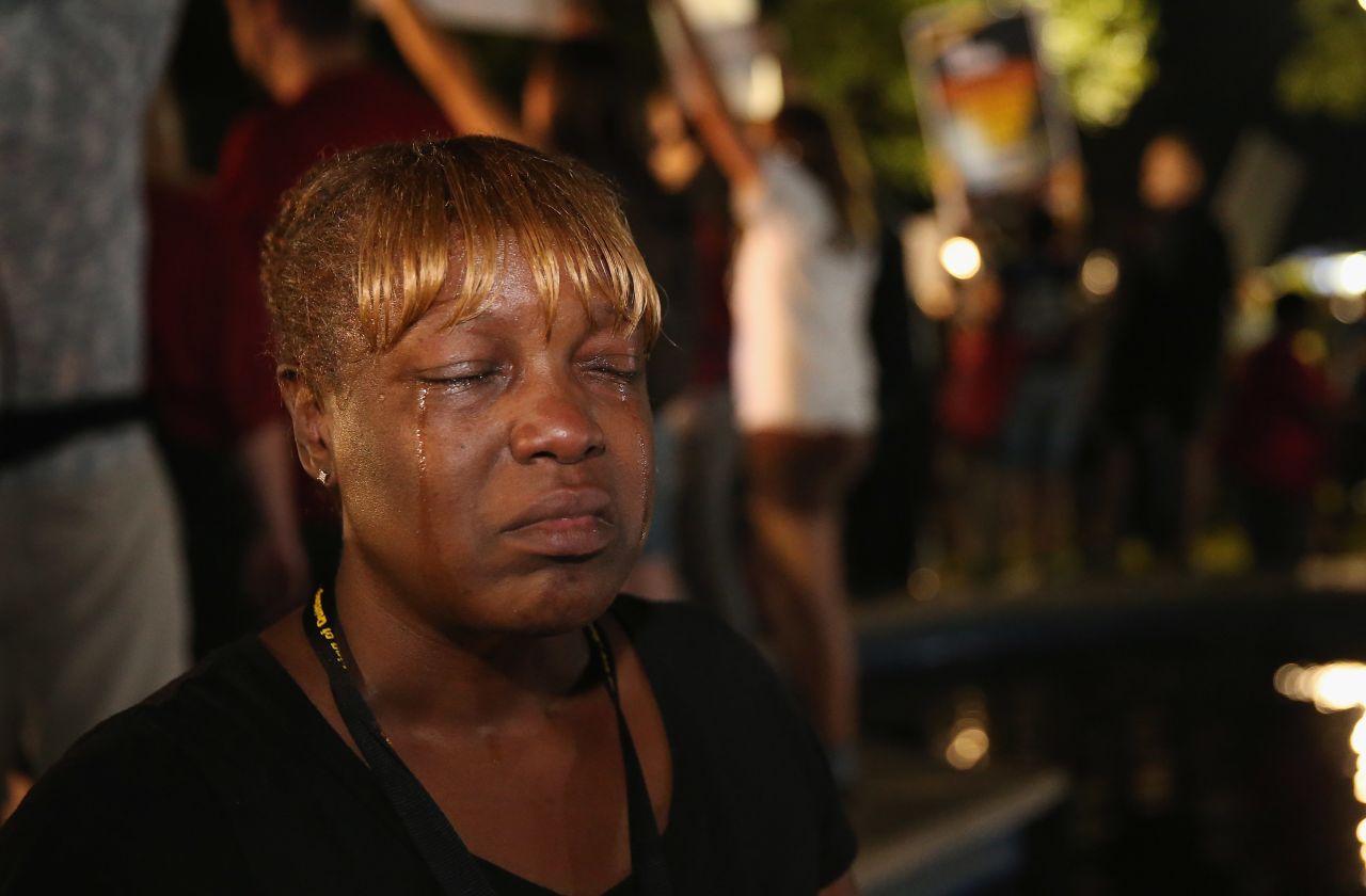 Tanetta Foster cries in front of the courthouse on July 13 after hearing the verdict.