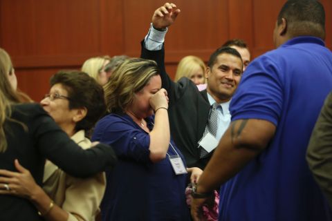 George Zimmerman's wife, Shellie Zimmerman, cries as friends and family members celebrate the verdict on July 13. 