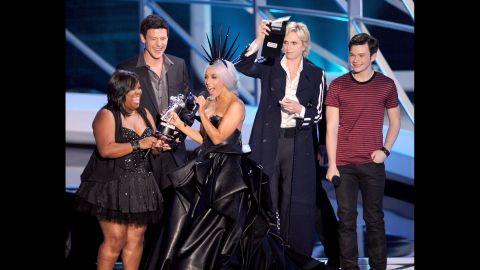 Lady Gaga, center, accepts the Best Pop Video award from actors Amber Riley, Cory Monteith, Jane Lynch and Chris Colfer at the 2010 MTV Video Music Awards. 