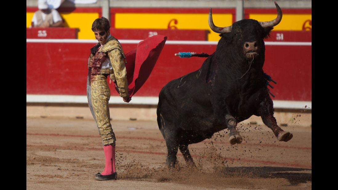 Bullfighter Juan Jose Padilla performs with a bull during the San Fermin festival on Saturday, July 13.