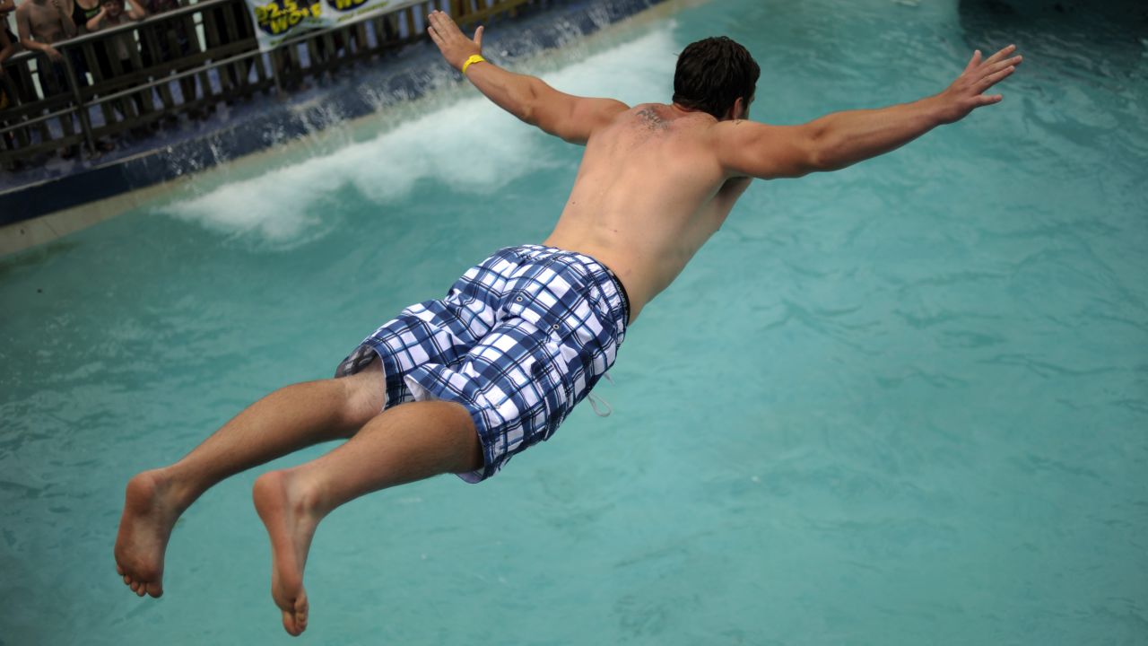 Matt Gackle belly-flops during the 15th annual Water World Belly-Flop Showdown in Denver in 2011.