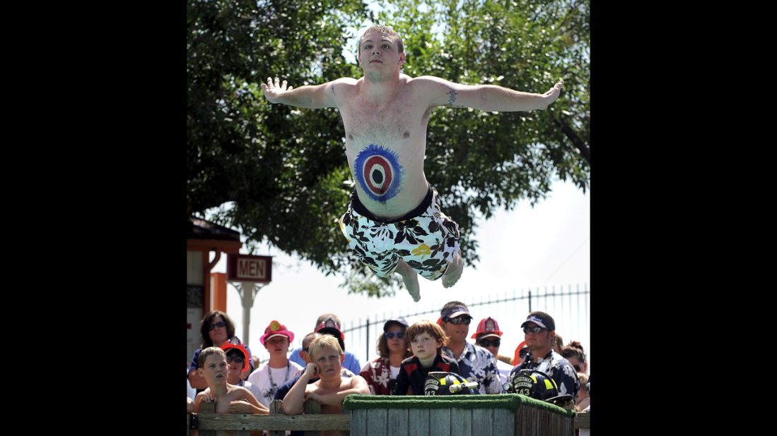 Gerald Magness flies through the air on his first of three belly-flops into the Calypso Cove pool in Federal Heights, Colorado, in 2009.