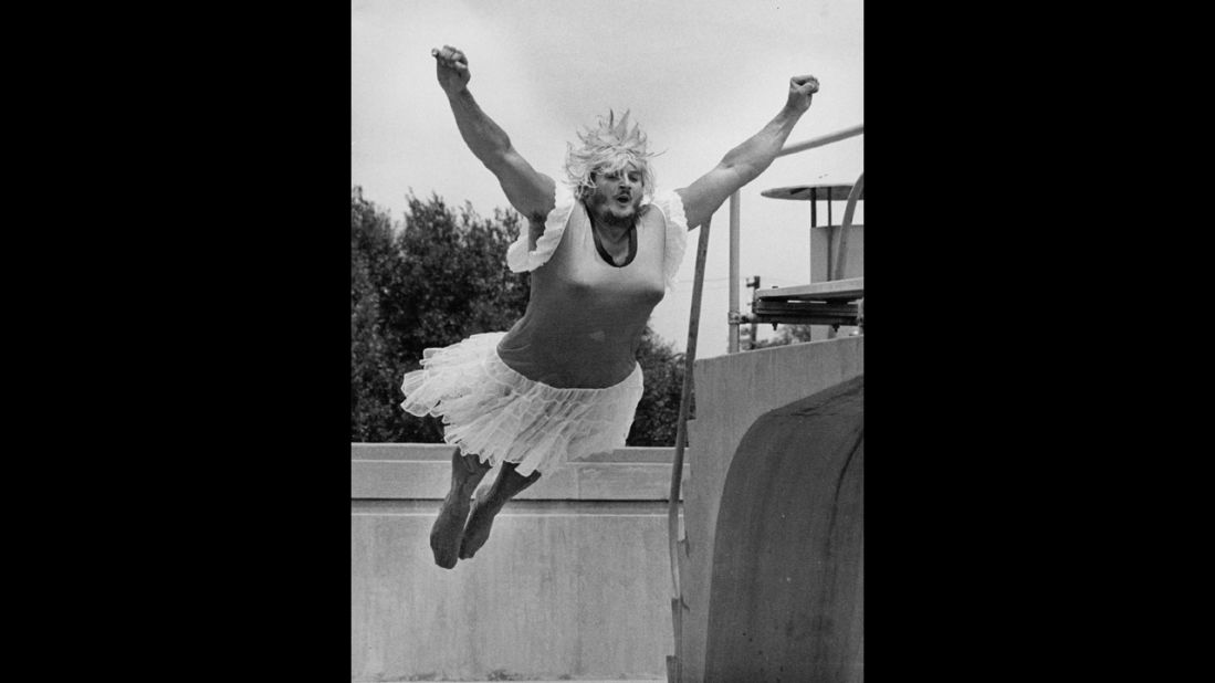 A man jumps into a pool during the World Belly-Flop & Cannonball Diving Championships in Colorado in 1981. The costume just adds a touch of flair.