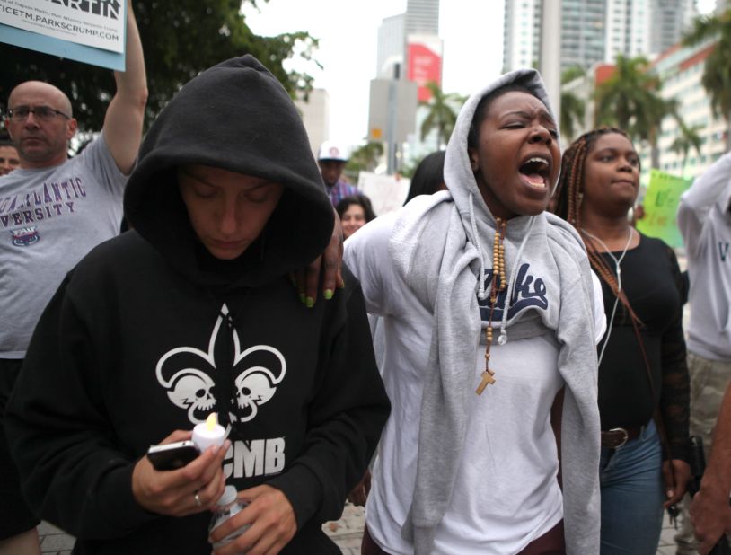 Demonstrators march following a rally at the Torch of Freedom in downtown Miami on July 14.