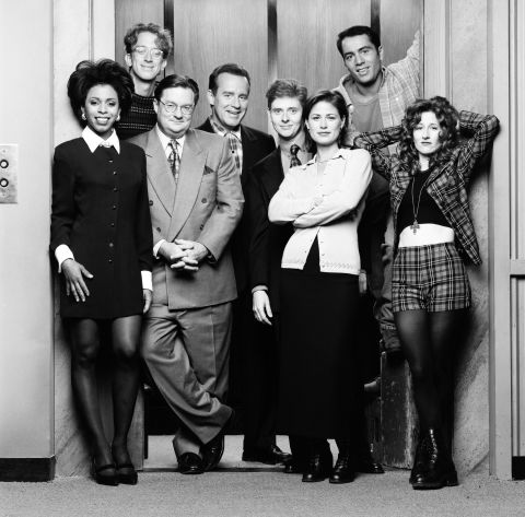 The "NewsRadio" cast, (from left), Khandi Alexander, Andy Dick, Stephen Root, Phil Hartman, Dave Foley, Maura Tierney, Joe Rogan and Vicki Lewis were pretty tight prior to Hartman's death. Hartman, who was shot to death by his wife in 1998, was revealed to have died of a heart attack at the beginning of the fifth season, and Hartman was replaced by actor Jon Lovitz.