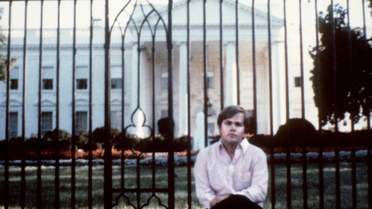 Hinckley poses for a photo in front of the White House. A federal judge committed Hinckley to St. Elizabeth's Hospital after a jury found him not guilty by reason of insanity in the spring of 1982.
