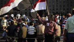Opponents of ousted President Mohammed Morsy gather in Egypt's landmark Tahrir square to break their fast in Cairo on July 12, 2013. 