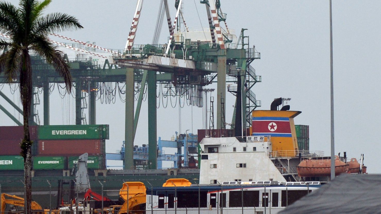 Panamanian inspectors are examining containers on a North Korean ship after weapons were found, officials say.