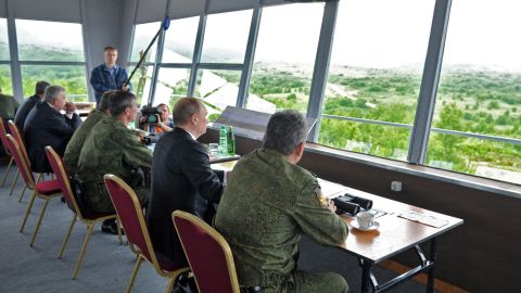 Putin, center, and Russian military personnel observe exercises on July 16.
