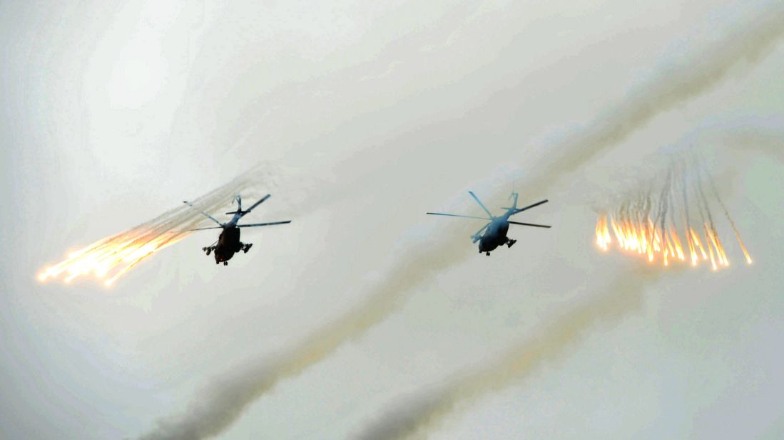 Russian Army helicopters fire flares over Sakhalin Island on July 16.