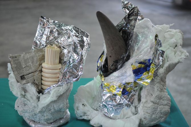 A rhino horn and ivory chopsticks and bracelets are all on display at Hong Kong's Customs and Excise Department offices on November 15, 2011, after authorities seized a container shipped from South Africa. 