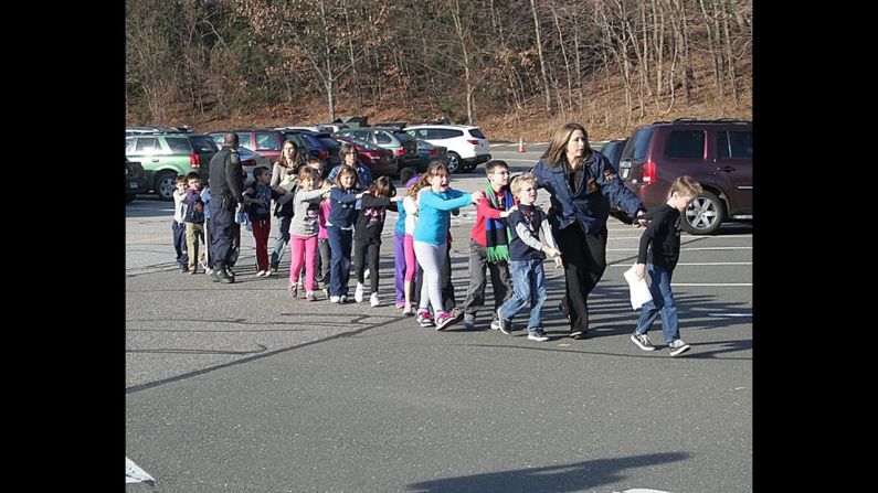 Connecticut State Police evacuate <a href="index.php?page=&url=http%3A%2F%2Fwww.cnn.com%2F2012%2F12%2F14%2Fus%2Fconnecticut-school-shooting%2Findex.html" target="_blank">Sandy Hook Elementary School</a> in Newtown, Connecticut, in December 2012. Adam Lanza opened fire in the school, killing 20 children and six adults before killing himself. Police said he also shot and killed his mother in her Newtown home. 