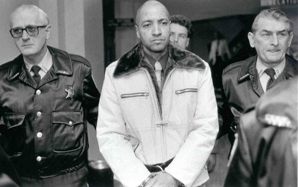 Prison guard George Banks is led through the Luzerne County courthouse in 1985. Banks killed 13 people, including five of his children, in Wilkes-Barre, Pennsylvania, in September 1982. He was sentenced to death in 1993 and received a stay of execution in 2004. His death sentence was overturned in 2010.